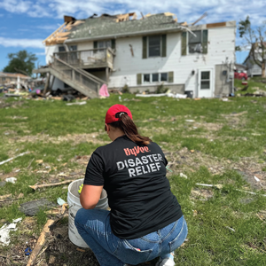 A Hy-Vee employee helping with disaster cleanup