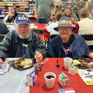 A senior couple eating breakfast