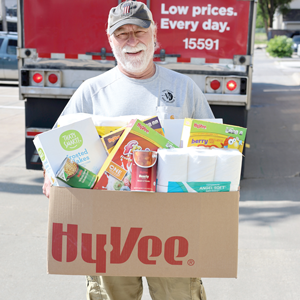 A man holding a box of food