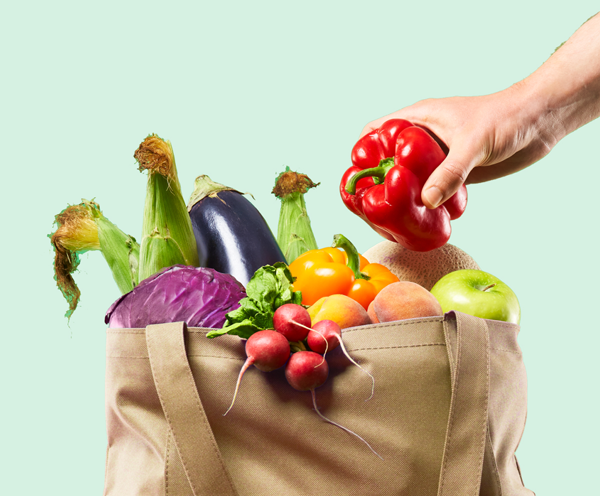 A shopping bag full of vegetables