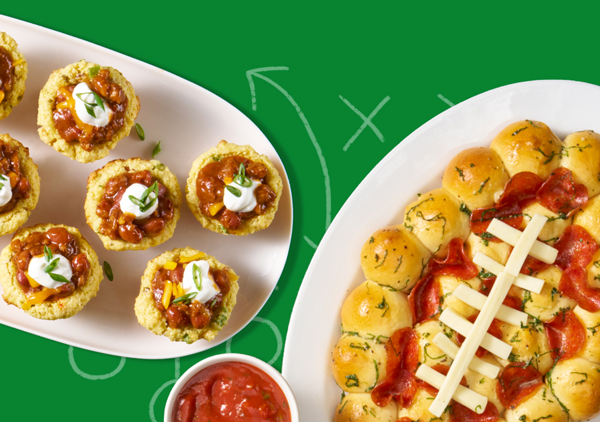 A football shaped pizza and other snacks